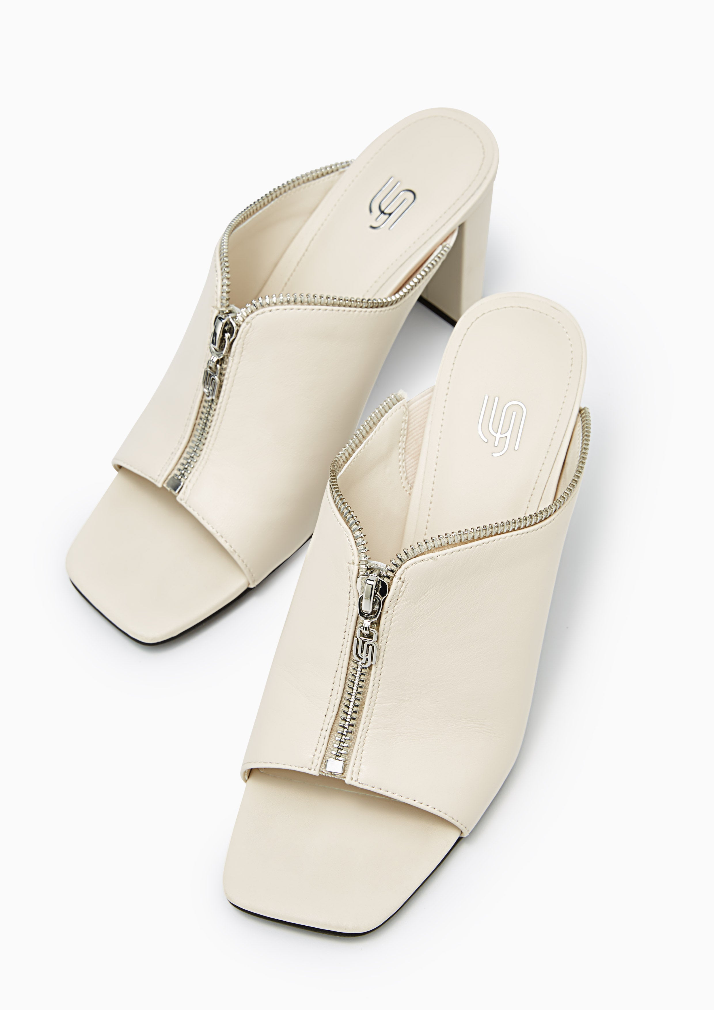 Jayden Infinite Zip Detail Mules White